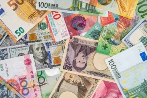 Should you exchange currency before you leave or when you arrive at your destination?